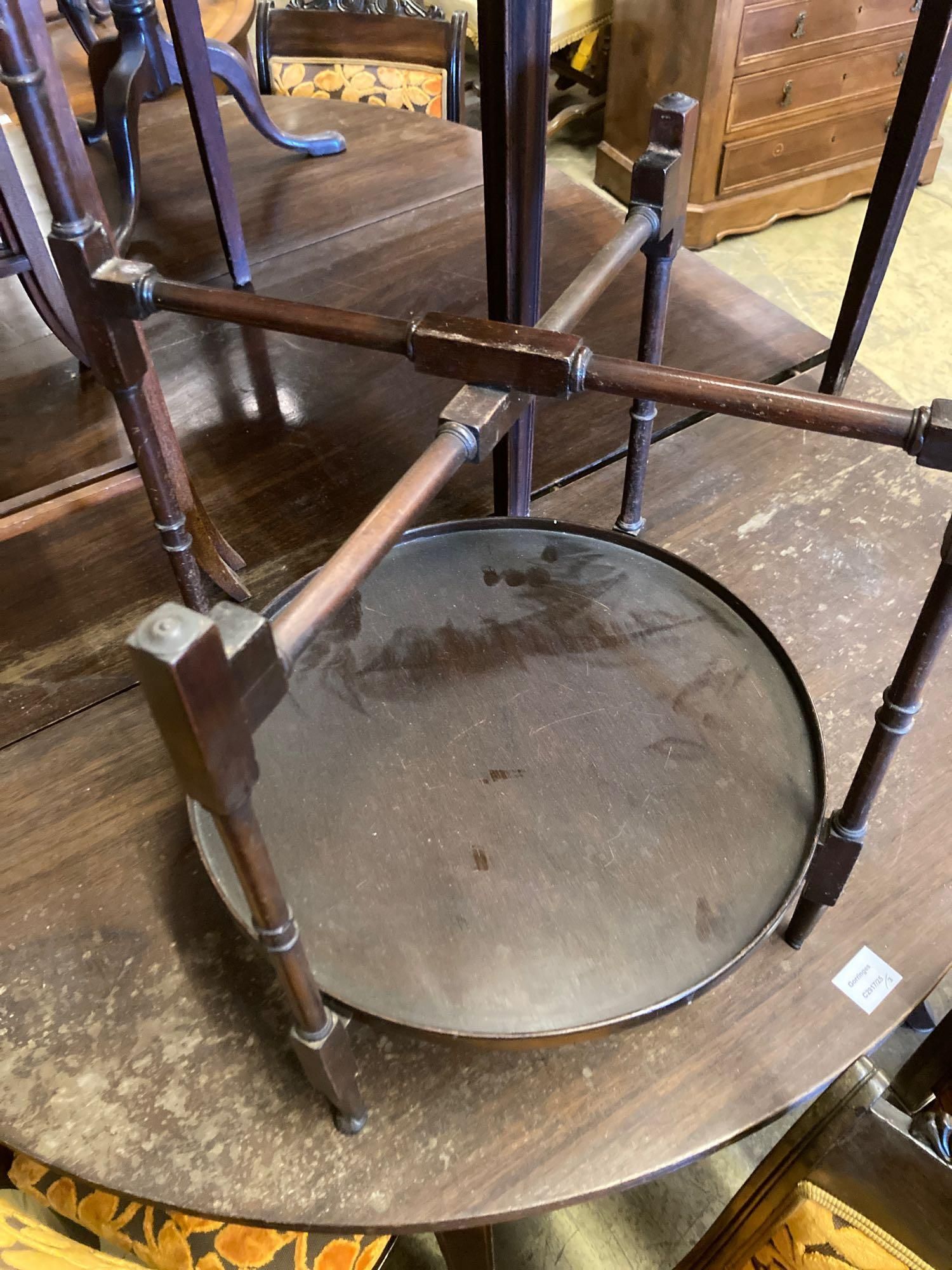 An Edwardian mahogany two tier folding occasional table, width 48cm height 71cm